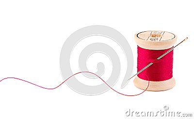 Sewing thread and needle Stock Photo