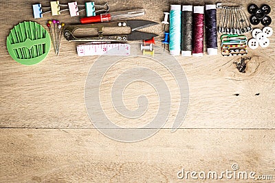 Sewing tools equipment space on wood Stock Photo