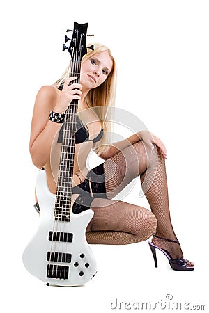 Sexual blonde and a white bass guitar Stock Photo