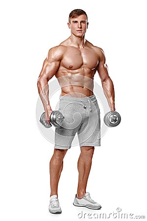 athletic man showing muscular body with dumbbells, full length, isolated over white background. Strong male naked torso abs Stock Photo