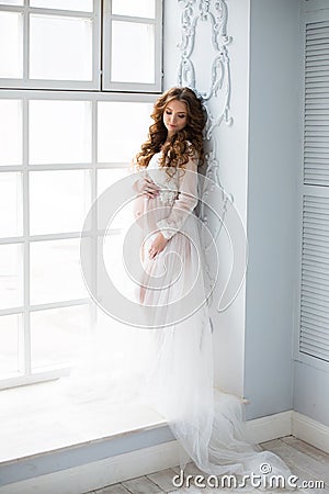 Sexy beatifull pregnant woman at white dress Stock Photo