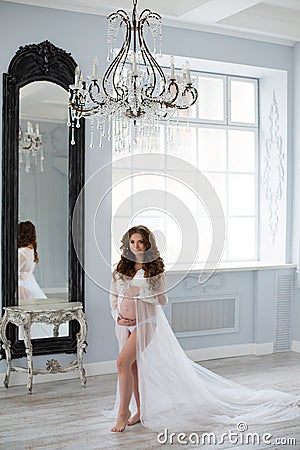 Sexy beatifull pregnant woman at white dress Stock Photo