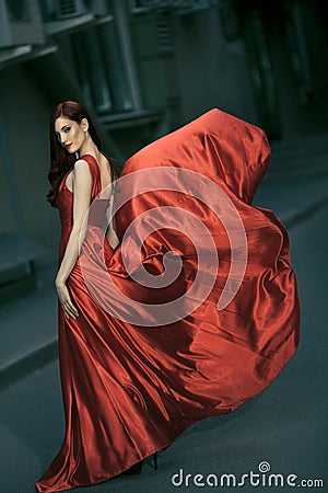 beauty woman in fluttering red dress Stock Photo