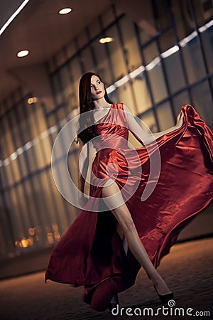 beauty woman in fluttering red dress Stock Photo