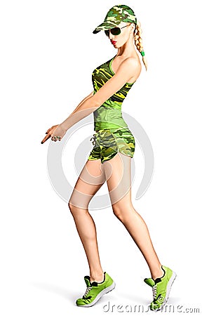 Fashion woman camouflage clothes doing gun gesture Stock Photo