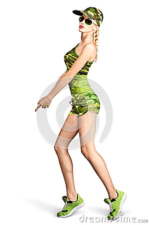 Fashion woman camouflage clothes doing gun gesture Stock Photo