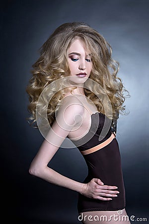 blond woman with curly hair Stock Photo