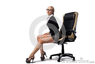 blonde secretary sitting in the office chair Stock Photo