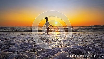 Brunette Woman with perfect Body running on the beach Stock Photo