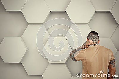 closeup portrait of Elegant handsome male model with fashion tattoo and a black beard standing and posing for model Stock Photo