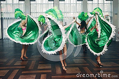 Sexy exotic belly dancers in traditional clothes with silk skirts performing at dance hall event in restaurant, beautiful woman Editorial Stock Photo