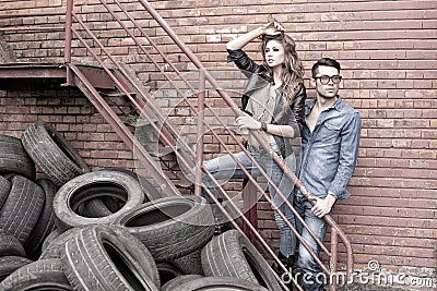 and fashionable couple wearing jeans dramatic Stock Photo