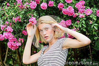 Sexy girl on pink rose background. summer and spring park nature. rose flower smell. Parfume. natural beauty. Spa and Stock Photo