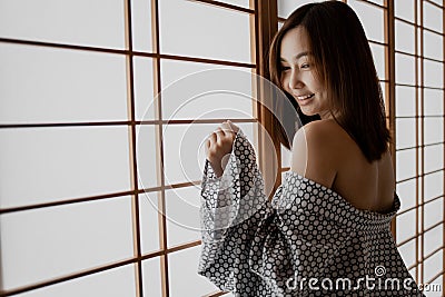Sexy girl wearing Yukata on lower body and nude on upper Stock Photo