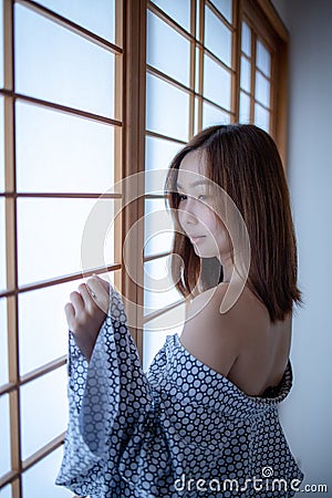 Sexy girl wearing Yukata on lower body and nude on upper Stock Photo