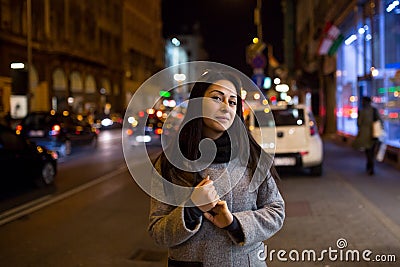 gorgeous brunette girl portrait in night city lights. Vogue fashion style portrait of young pretty beautiful woman Stock Photo