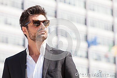 gorgeous stylish man. Sunglasses. City style Stock Photo