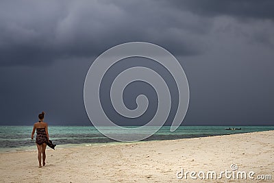 Sexy lady walking along Kendwa beach on Zanzibar Editorial Stock Photo