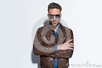 Sexy macho casual man crossing his arms Stock Photo