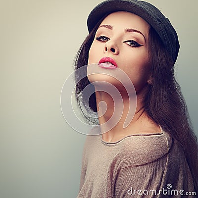 makeup woman in cap posing with pink lipstick Stock Photo