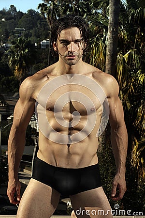male fitness model outdoors Stock Photo