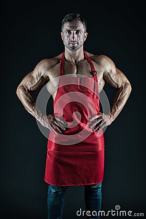 Sexy man cook. man with muscular torso in chef apron. cuisine. male housewife. husband in kitchen. brutal butcher. food Stock Photo