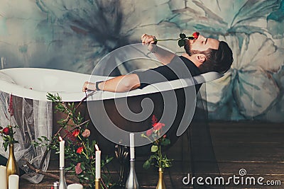 man with a rose in the tub Stock Photo