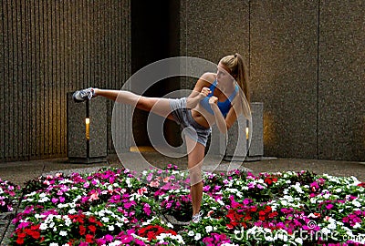mixed-martial arts (MMA) woman kicking Stock Photo