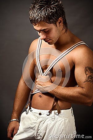 muscular shirtless young man Stock Photo