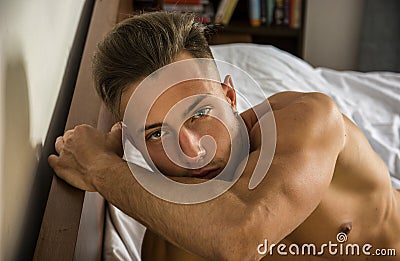 naked young man on bed Stock Photo