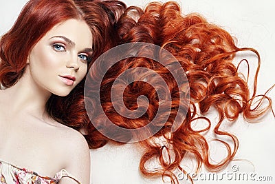 nude beautiful redhead girl with long hair. Perfect woman portrait on light background. Gorgeous hair and deep eyes. Natural Stock Photo