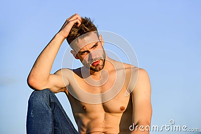 Sexy pensive man relaxing outdoors. Male beauty. Fashion guy. Attractive and mysterious. Athletic handsome macho Stock Photo