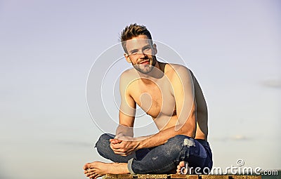 Sexy pensive man relaxing outdoors. Male beauty. Fashion guy. Attractive and mysterious. Muscular bare torso. Summer Stock Photo