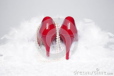 Red Pumps with Pearls and Boa Stock Photo