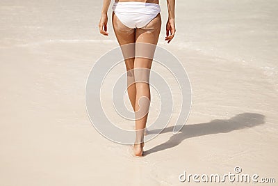 sandy woman buttocks on tropical beach Stock Photo