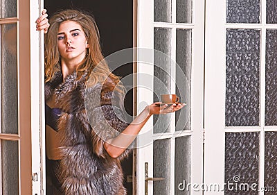 Sexy servant bring morning coffee. Seduction art concept. Woman seductive wear fur and lingerie. Female lover enter Stock Photo