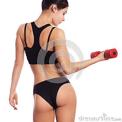 slim fit woman body with dumbbells. Muscled back. Sportswea Stock Photo