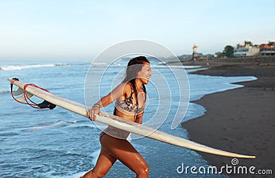 Sexy Surfer. Surfing Girl In Bikini With Surfboard Walking Out Of Ocean. Smiling Tanned Brunette Going On Beach. Water Sport For Stock Photo