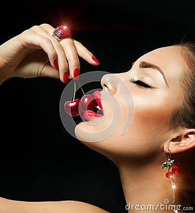 Woman Eating Cherry Stock Photo