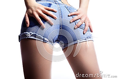 woman in fashion blue jeans shorts. Perfect hot booty and erotic curves hips. Good body shapes whithout cellulite Stock Photo