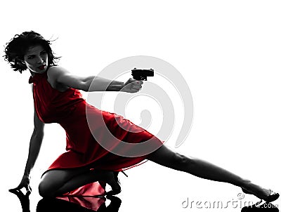 woman holding gun silhouette Stock Photo