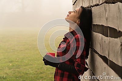 woman in jeans shorts, checked shirt posing on white background. Summer fashion photo. Fitness body Stock Photo