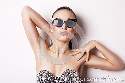 woman in luxurious corset and sunglasses Stock Photo