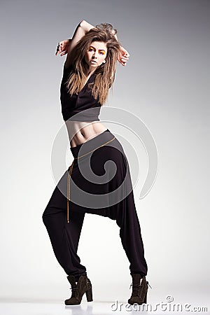 woman model posing in large pants - studio fashion shot Stock Photo