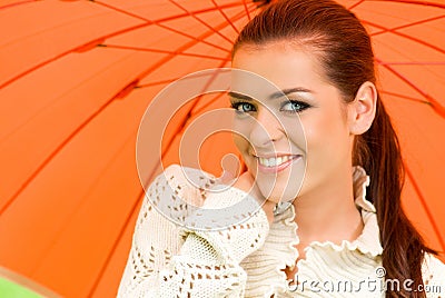 woman and orange umbrella Stock Photo
