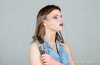 Sexy woman with professional make up brush. sexuality. skincare cosmetics. fashion makeup visage. woman with long hair Stock Photo