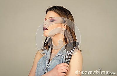 Sexy woman with professional make up brush. sexuality. skincare cosmetics. fashion makeup visage. woman with long hair Stock Photo