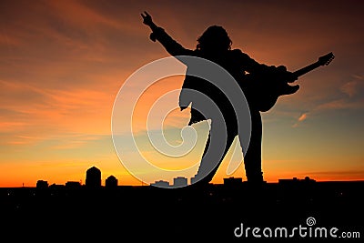 Woman Rock and Roll Sunset Stock Photo