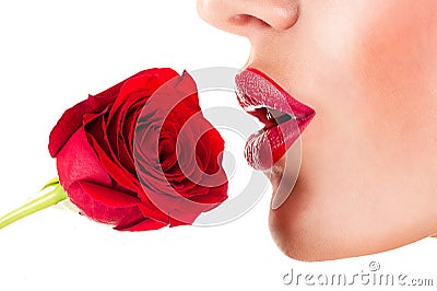woman smelling flower, sensual red lips Stock Photo