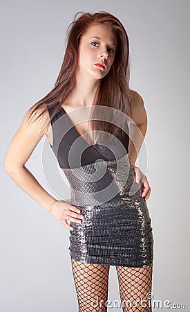 Woman in Tight Dress with Fishnet Pantyhose Stock Photo